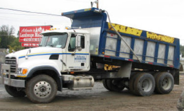 An image of a double-axle tandem dump truck.