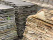 A picture of three stacks of thin veneer flagstone pieces.